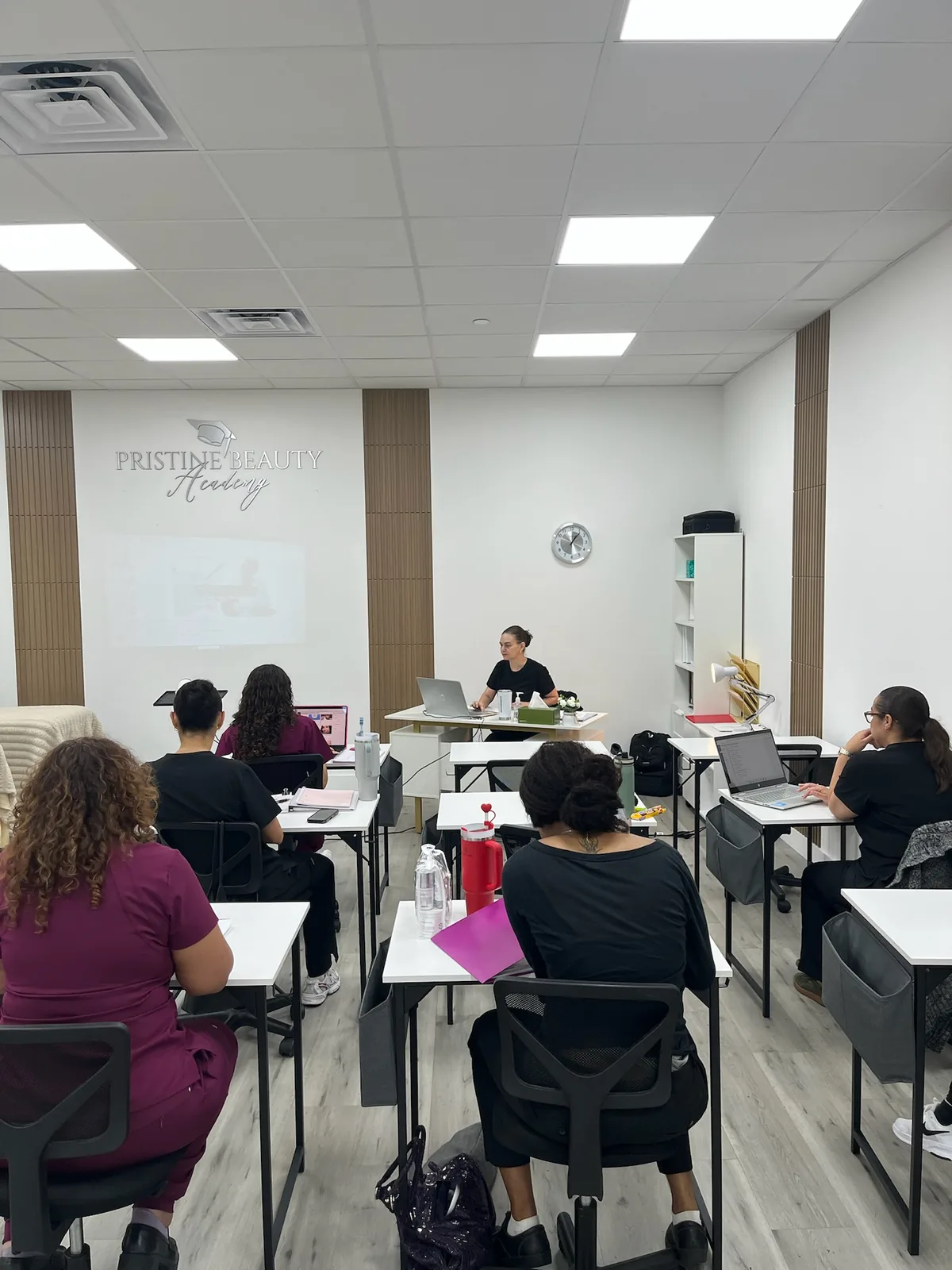 Students in the Pristine Beauty Academy classroom